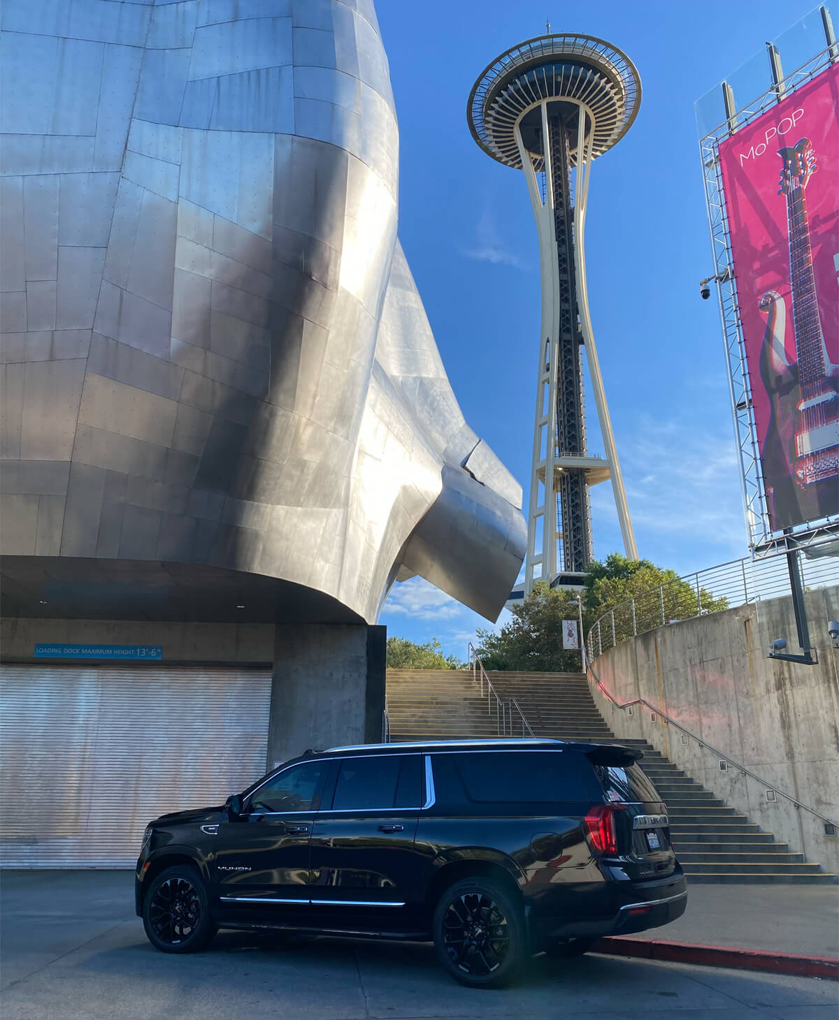 Starline's limo in front of Seattle's Museum of Pop Culture with Space Needle in the background